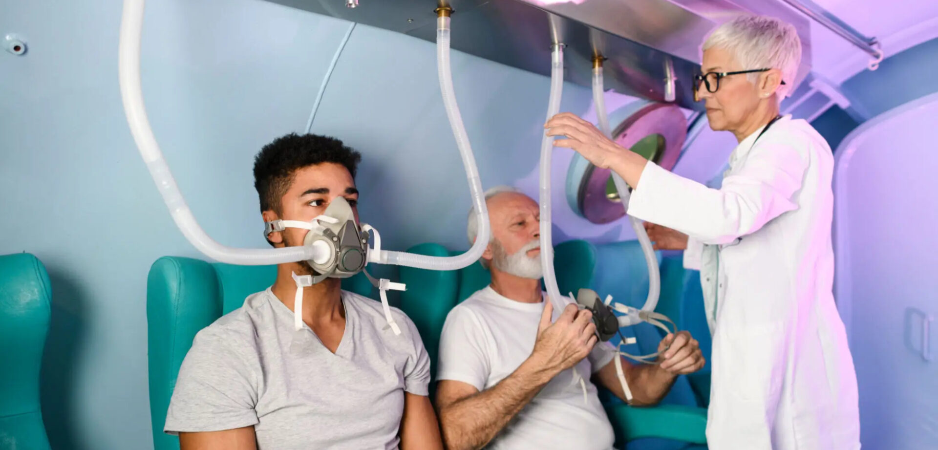 Two men using CPAP machines for sleep apnea treatment.