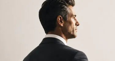 Man in suit profile looking to the right